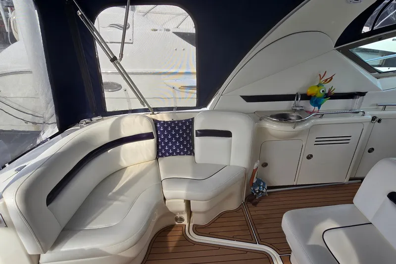 Slide: The Image of Luxurious interior of 2008 Sea Ray 38 Sundancer yacht with plush seating and nautical decor. - 7