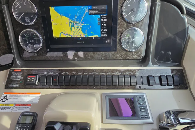 Slide: The Image of Dashboard of a 2008 Sea Ray 38 Sundancer with Garmin navigation system and control panel. - 15