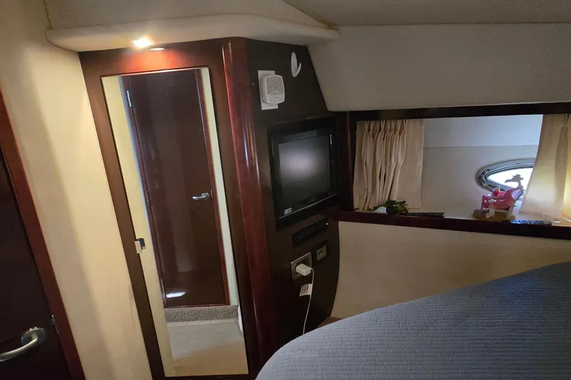 Slide: The Image of Interior of 2008 Sea Ray 38 Sundancer yacht with TV, mirror, and window. - 32