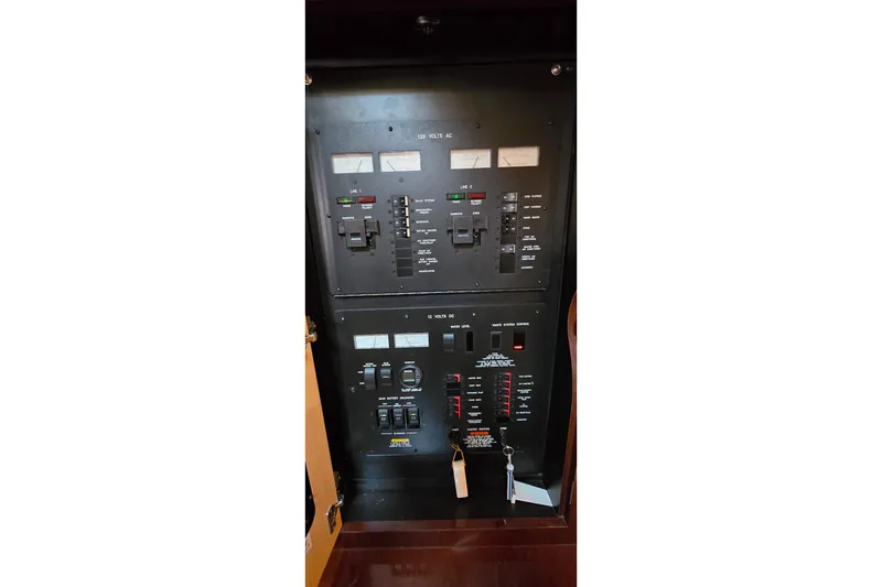 Slide: The Image of Electrical control panel on a 2008 Sea Ray 38 Sundancer boat. - 39