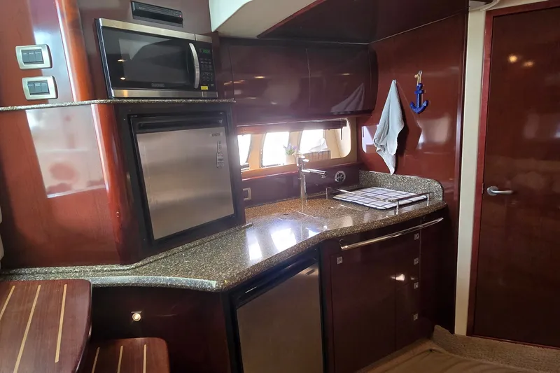 Slide: The Image of Luxurious kitchen area in a 2008 Sea Ray 38 Sundancer yacht with modern appliances. - 20