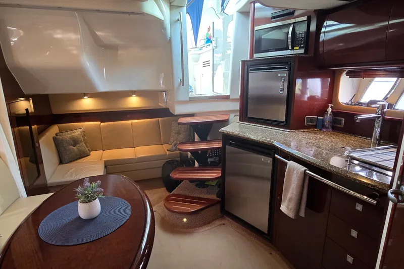 Slide: The Image of Luxurious 2008 Sea Ray 38 Sundancer yacht interior with modern kitchen and cozy seating area. - 37