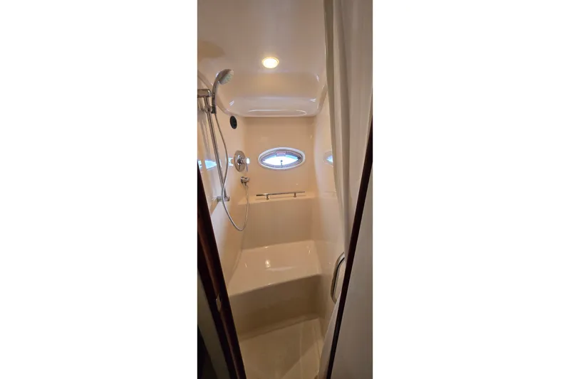 Slide: The Image of Bathroom interior of 2008 Sea Ray 38 Sundancer yacht with shower and porthole window. - 33