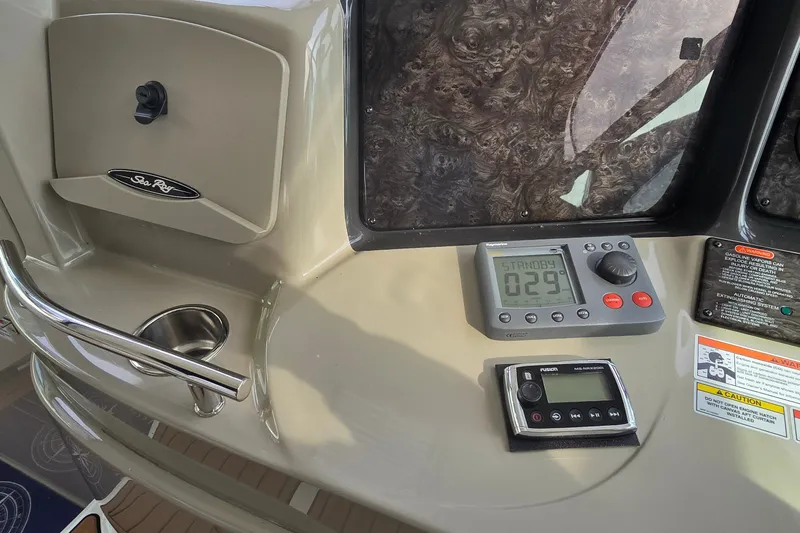 Slide: The Image of Control panel of a 2008 Sea Ray 38 Sundancer boat with navigation instruments. - 17