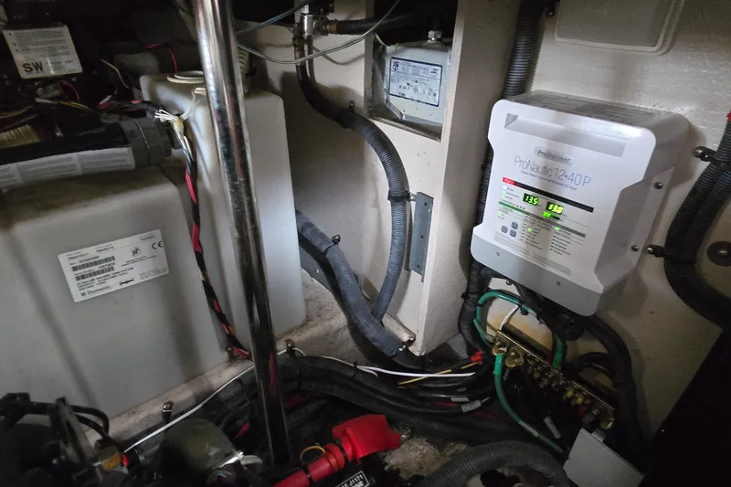 Slide: The Image of Engine room of 2008 Sea Ray 38 Sundancer with ProNautic 12-40P charger and wiring. - 43