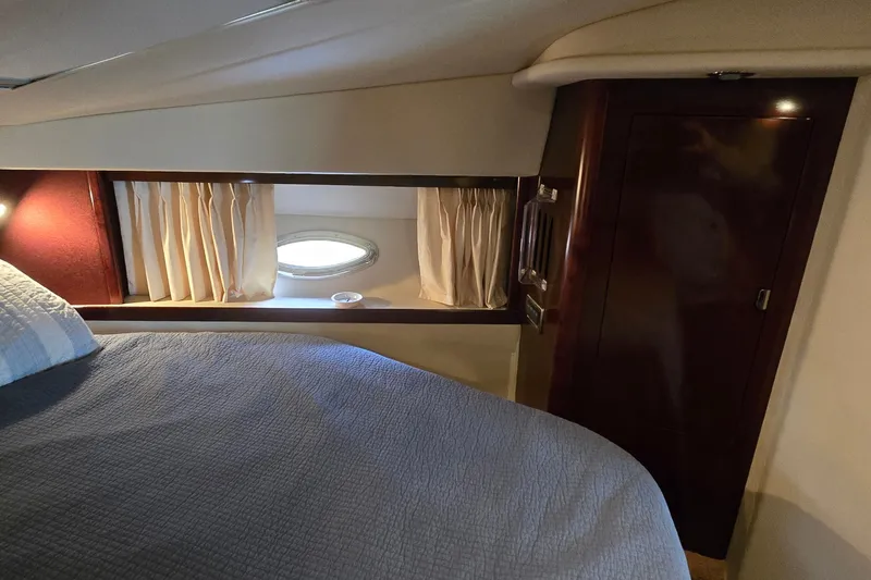 Slide: The Image of Interior cabin of 2008 Sea Ray 38 Sundancer yacht with bed and porthole window. - 31