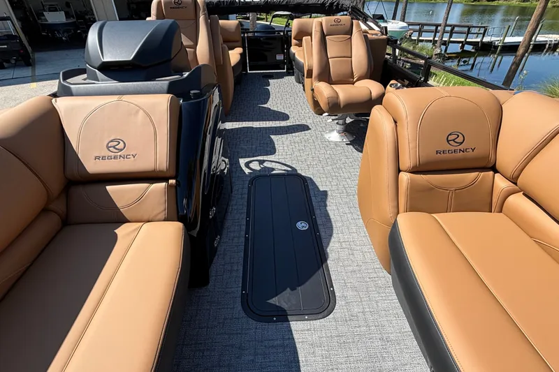 Slide: The Image of Luxurious interior of 2027 Regency 230 DL3 pontoon boat with tan leather seating. - 20