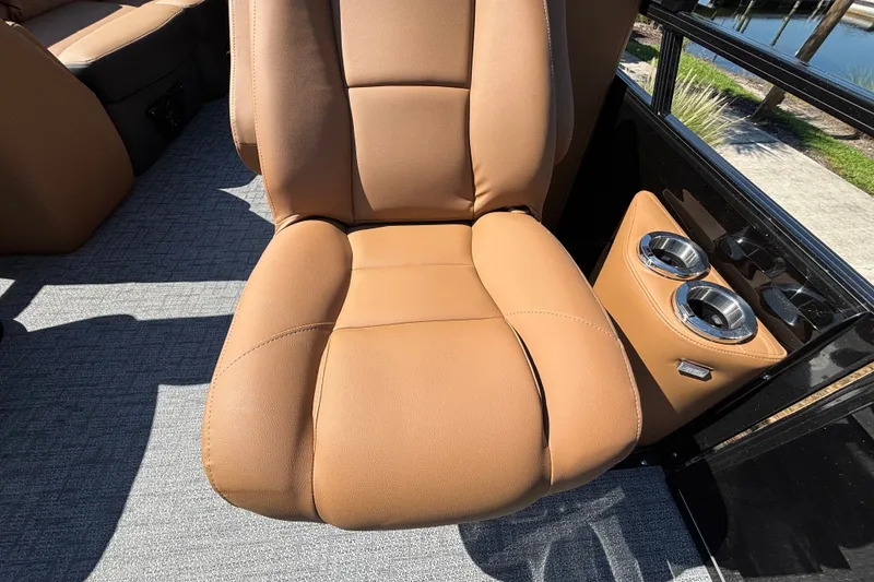 Slide: The Image of Luxurious tan seat with cup holders in 2027 Regency 230 DL3 boat. - 17
