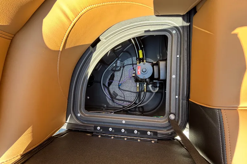 Slide: The Image of Interior compartment of 2027 Regency 230 DL3 boat, showcasing wiring and components. - 16
