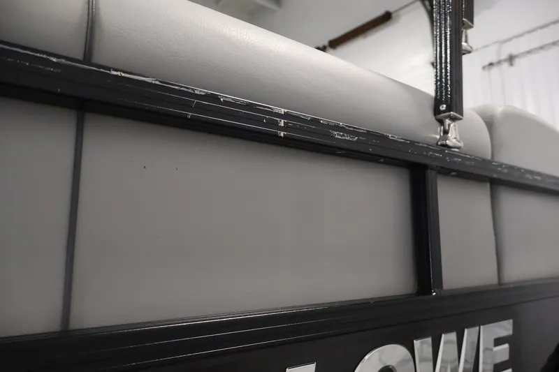 Slide: The Image of 2021 Lowe SS 210 CL boat interior detail with gray upholstery and black frame. - 45