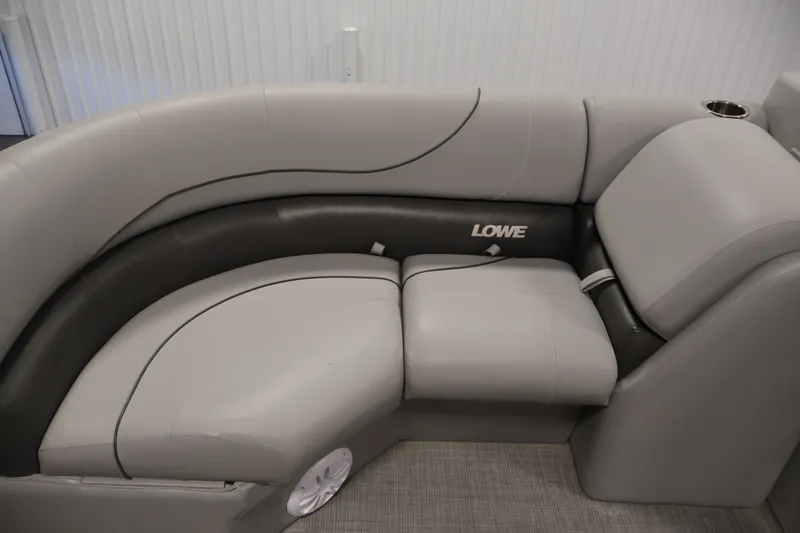 Slide: The Image of 2021 Lowe SS 210 CL boat interior with gray cushioned seating and cup holder. - 13
