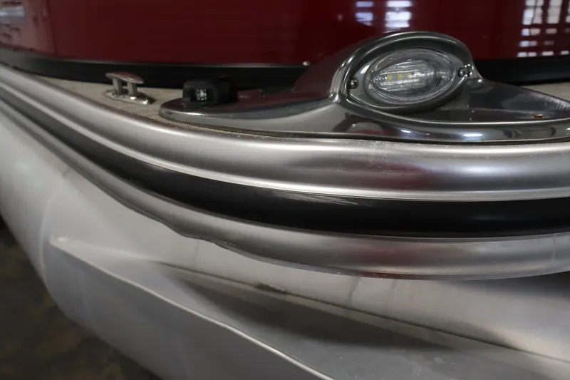 Slide: The Image of Close-up of 2021 Lowe SS 210 CL pontoon boat's sleek aluminum railing and navigation light. - 41