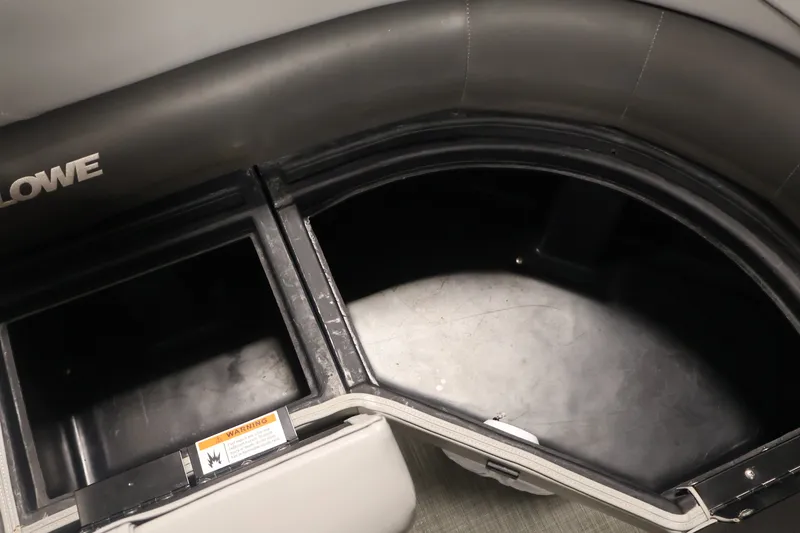Slide: The Image of Interior storage compartment of 2021 Lowe SS 210 CL boat, featuring durable seating and storage space. - 12