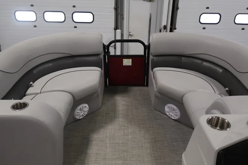 Slide: The Image of Interior of 2021 Lowe SS 210 CL pontoon boat with gray seating and cup holders. - 10