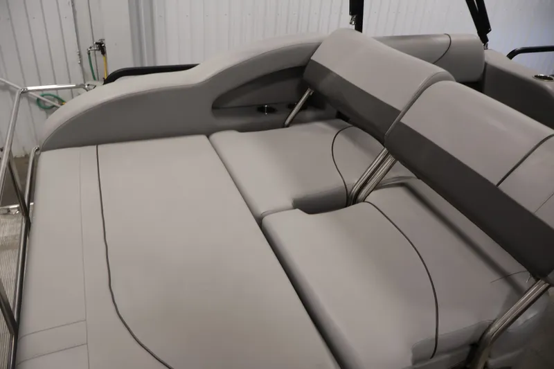 Slide: The Image of 2021 Lowe SS 210 CL boat interior with gray cushioned seating. - 30