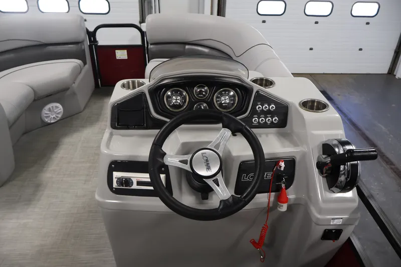 Slide: The Image of 2021 Lowe SS 210 CL boat interior with steering wheel and control panel. - 18