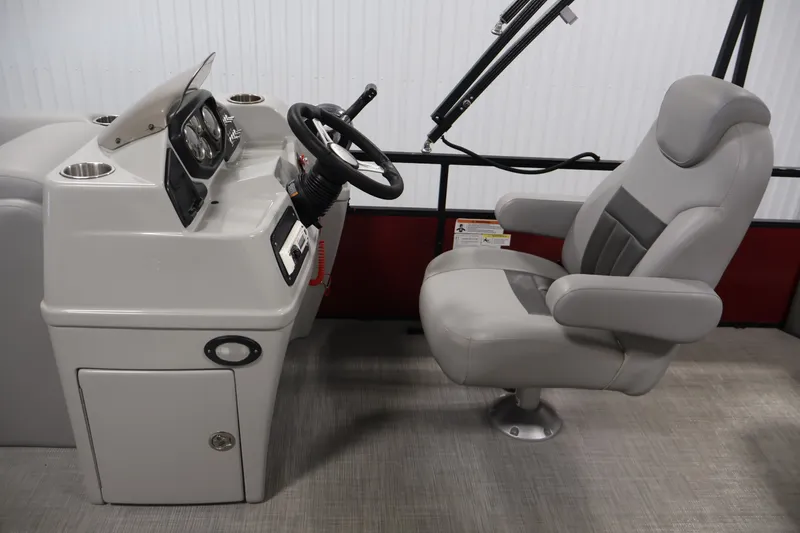Slide: The Image of 2021 Lowe SS 210 CL boat helm with steering wheel and captain's chair. - 16