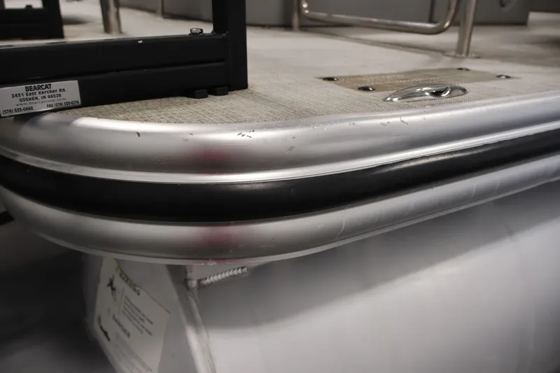 Slide: The Image of Close-up of 2021 Lowe SS 210 CL pontoon boat corner with metal trim and deck details. - 43