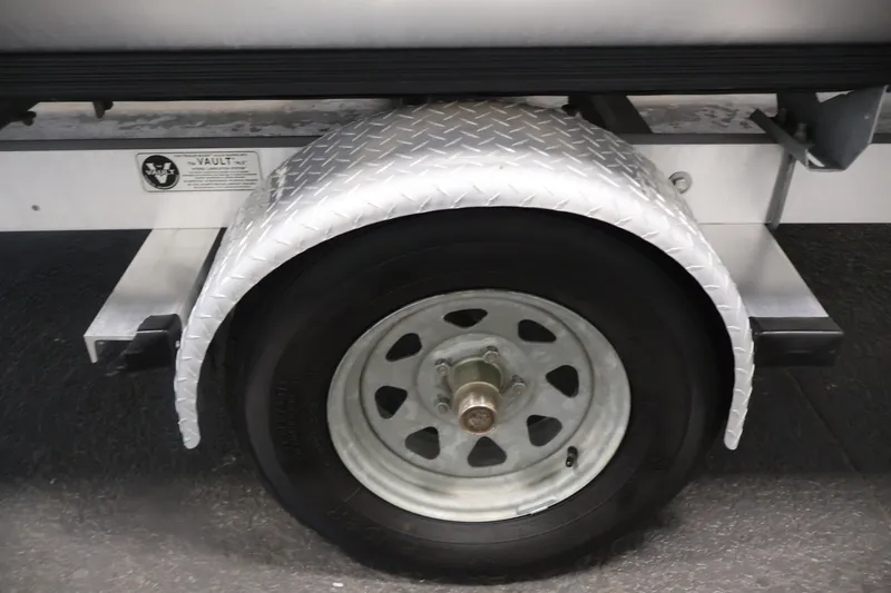 Slide: The Image of Close-up of a 2021 Lowe SS 210 CL trailer wheel with diamond plate fender. - 40