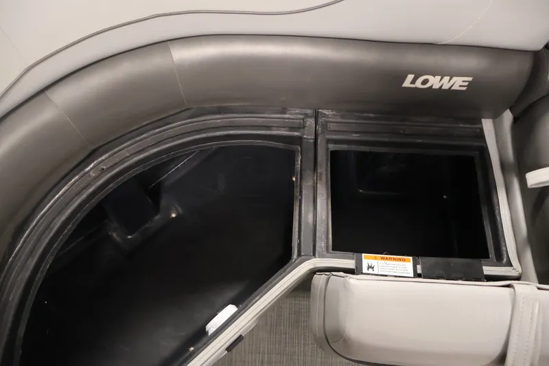 Slide: The Image of Interior storage compartments of a 2021 Lowe SS 210 CL boat. - 14