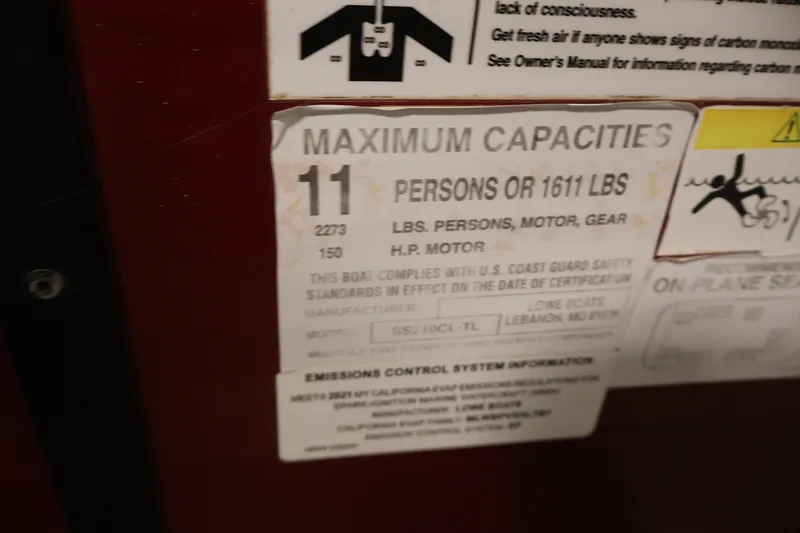 Slide: The Image of Capacity label on 2021 Lowe SS 210 CL boat, showing limits for persons and weight. - 24