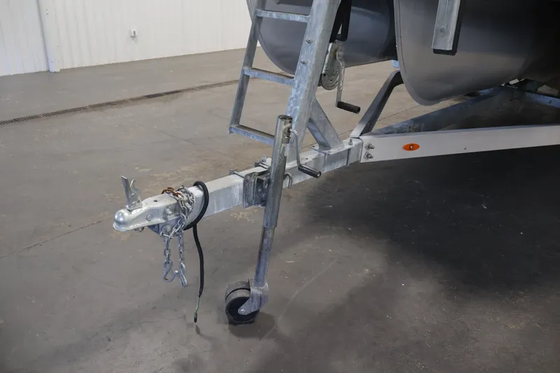 Slide: The Image of Trailer hitch of a 2021 Lowe SS 210 CL boat in a garage setting. - 37