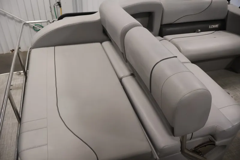Slide: The Image of 2021 Lowe SS 210 CL boat interior with gray seating and sleek design. - 29