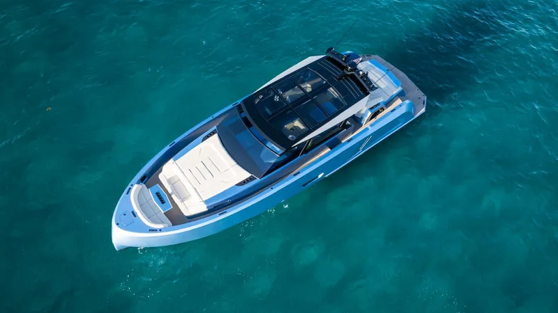 Slide: The Image of 2024 Vanquish Yachts VQ58 luxury yacht on clear blue water. - 1