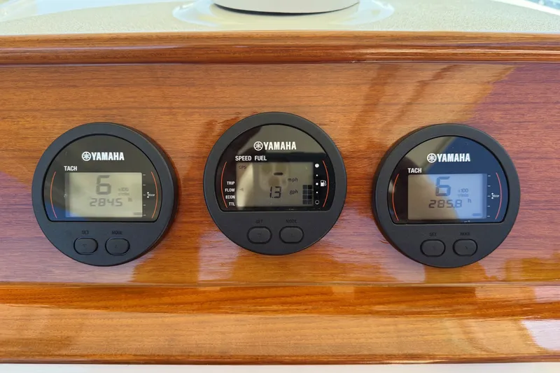 Slide: The Image of Yamaha gauges on 2018 Hunt 32cc boat dashboard, displaying speed and tachometer readings. - 14