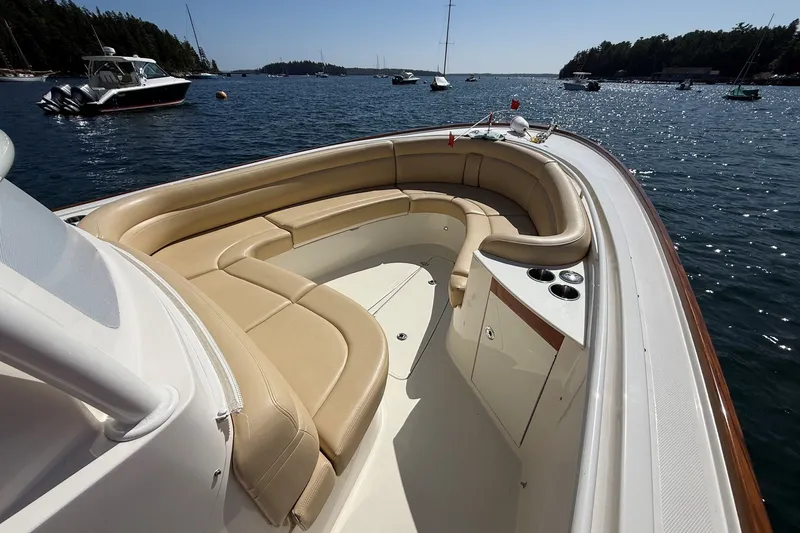 Slide: The Image of Luxurious 2018 Hunt 32cc boat with spacious seating, docked in a scenic marina. - 25
