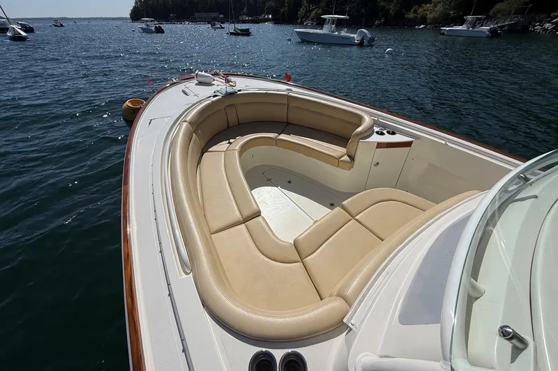 Slide: The Image of Luxurious 2018 Hunt 32cc boat with spacious seating on calm waters. - 26