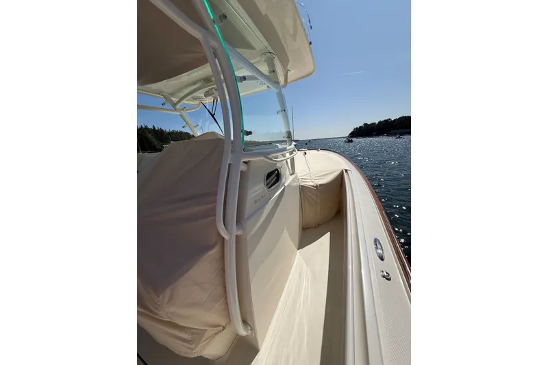 Slide: The Image of 2018 Hunt 32cc boat on water, sunny day, sleek design, coastal view. - 32