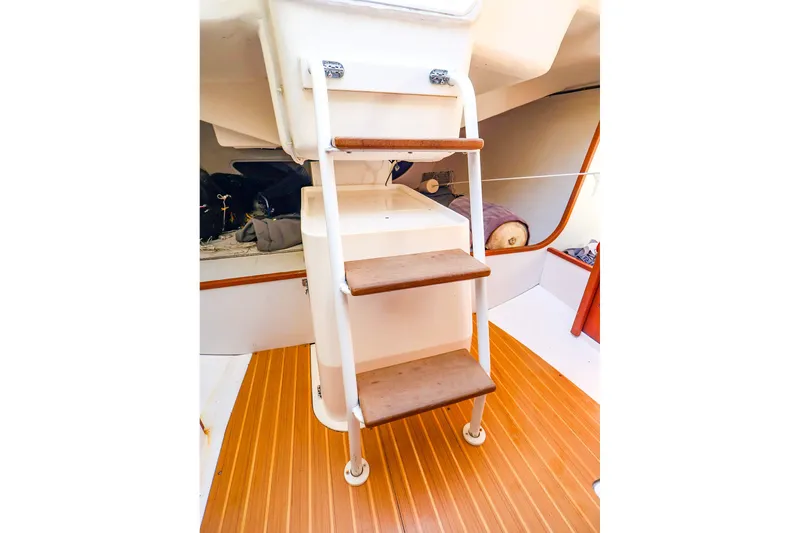 Slide: The Image of Interior view of 2014 J Boats J/111 sailboat with wooden steps and cabin area. - 44