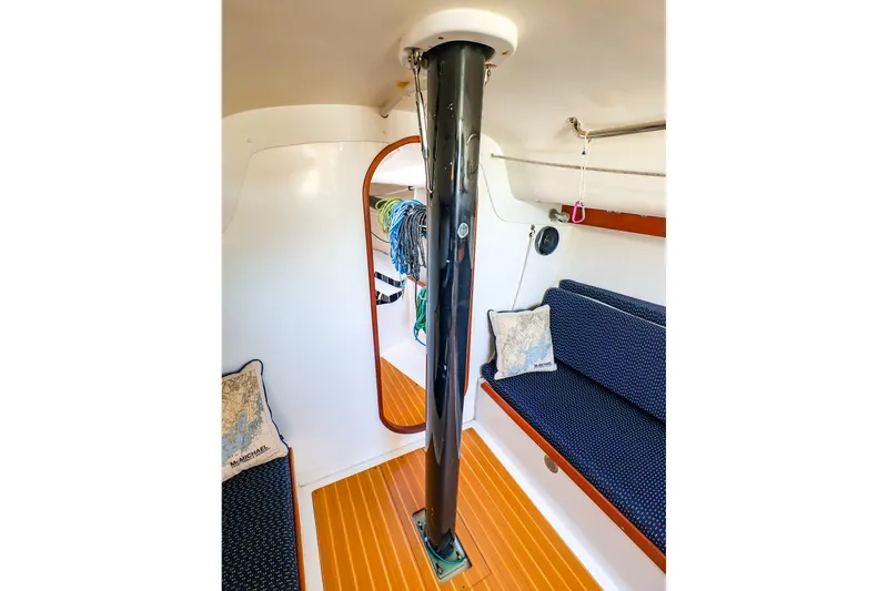Slide: The Image of Interior of 2014 J Boats J/111 sailboat, featuring seating and mast support. - 42