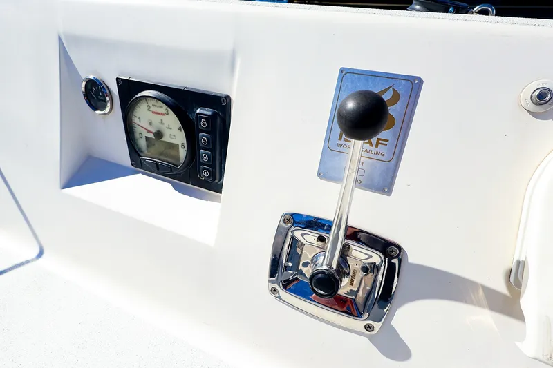 Slide: The Image of Control panel of a 2014 J Boats J/111 sailboat with throttle and gauge. - 14