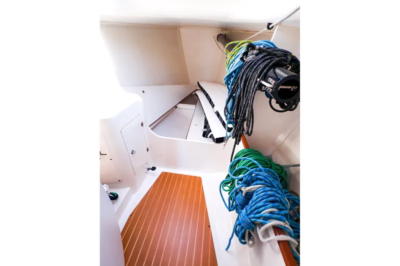 Slide: The Image of Interior of 2014 J Boats J/111 sailboat with ropes and wooden flooring. - 39