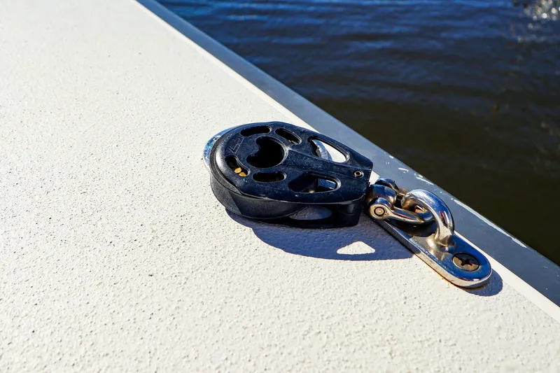 Slide: The Image of Close-up of a pulley on a 2014 J Boats J/111 sailboat deck. - 19