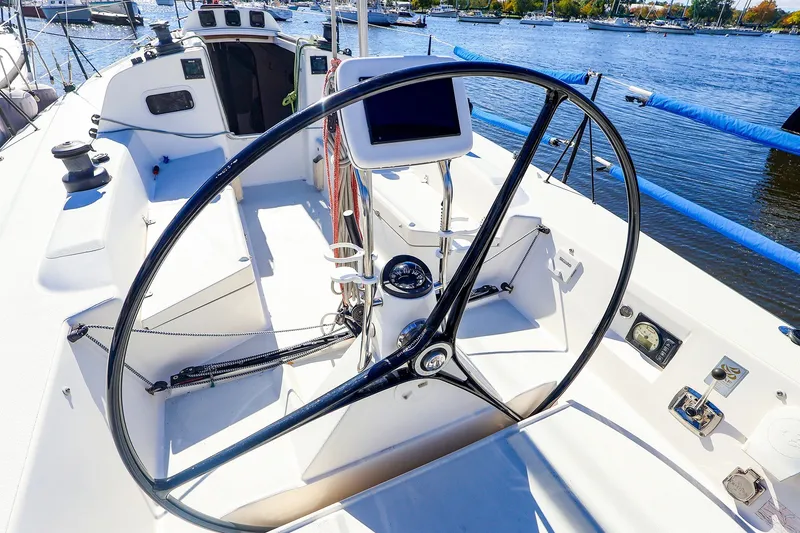 Slide: The Image of Cockpit of 2014 J Boats J/111 sailboat with steering wheel and navigation equipment. - 16
