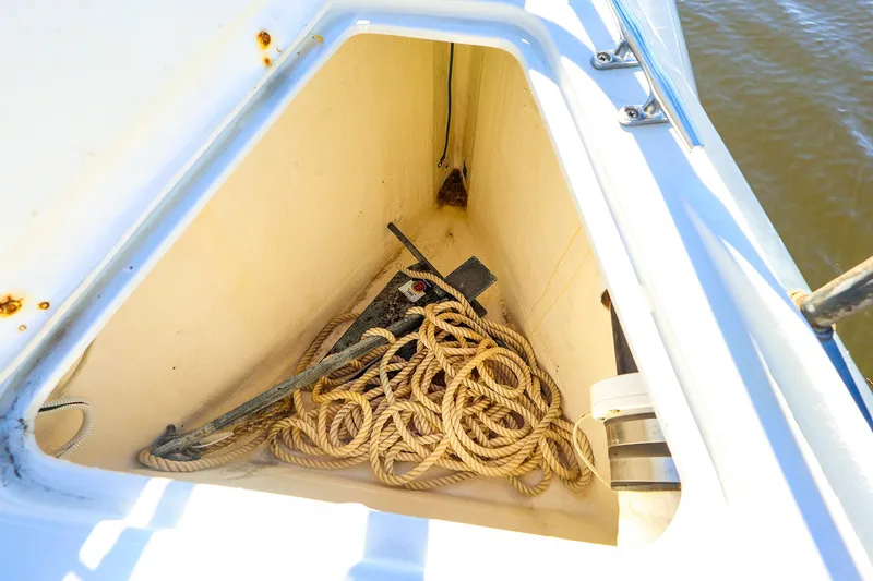 Slide: The Image of Anchor locker of 2014 J Boats J/111 with rope and anchor inside. - 24