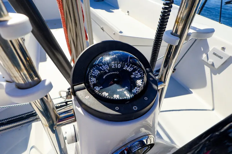 Slide: The Image of Compass on 2014 J Boats J/111 sailboat, surrounded by stainless steel fittings. - 18