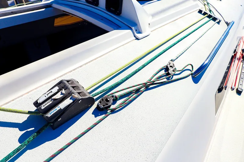 Slide: The Image of Close-up of 2014 J Boats J/111 deck with colorful ropes and pulleys. - 20