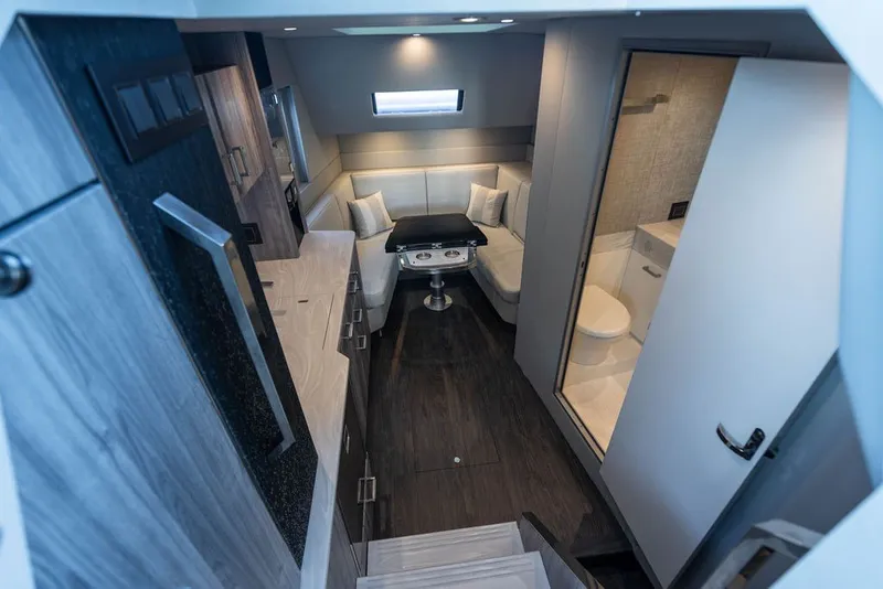 Slide: The Image of Luxurious interior of 2025 Formula 500 Super Sport Crossover yacht, featuring modern seating and amenities. - 35