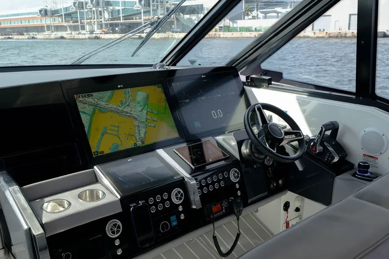 Slide: The Image of 2025 Formula 500 Super Sport Crossover cockpit with advanced navigation displays and controls. - 86