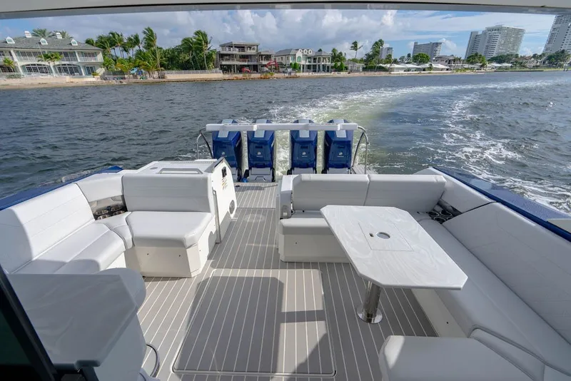 Slide: The Image of 2025 Formula 500 Super Sport Crossover luxury boat interior with spacious seating and table. - 53