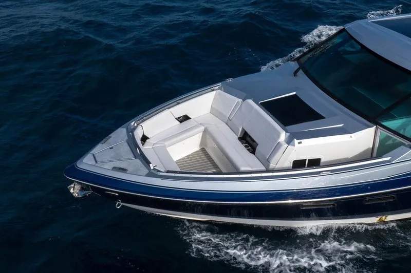 Slide: The Image of 2025 Formula 500 Super Sport Crossover cruising on open water, showcasing sleek design and luxury seating. - 34