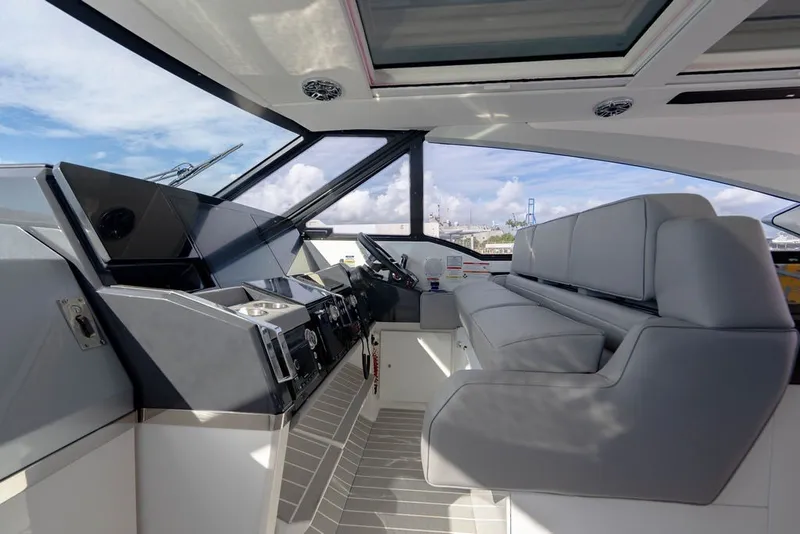 Slide: The Image of Interior of 2025 Formula 500 Super Sport Crossover boat with modern helm and seating. - 83