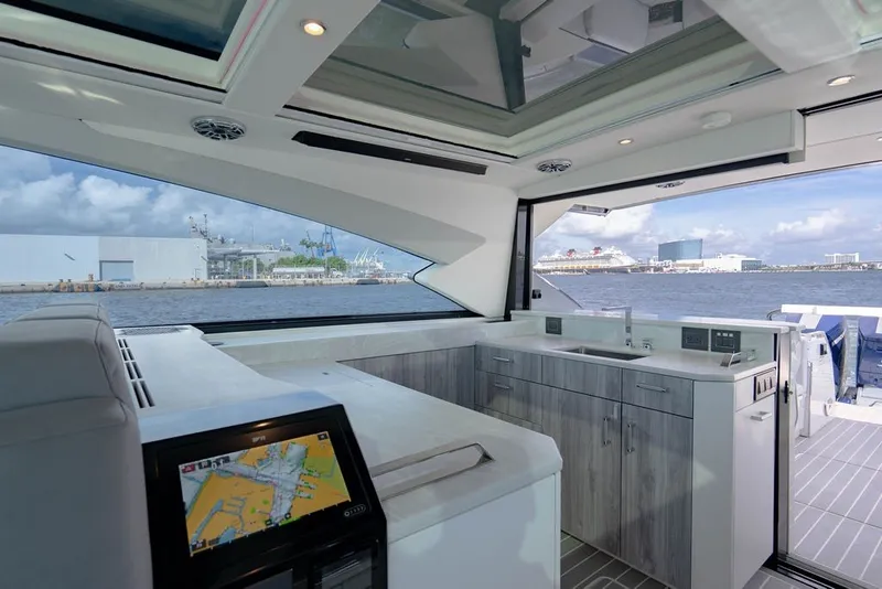 Slide: The Image of Luxurious interior of 2025 Formula 500 Super Sport Crossover yacht with modern amenities and waterfront view. - 95