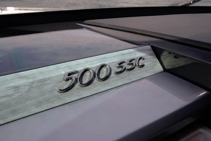 Slide: The Image of 2025 Formula 500 Super Sport Crossover emblem on sleek metallic surface. - 111