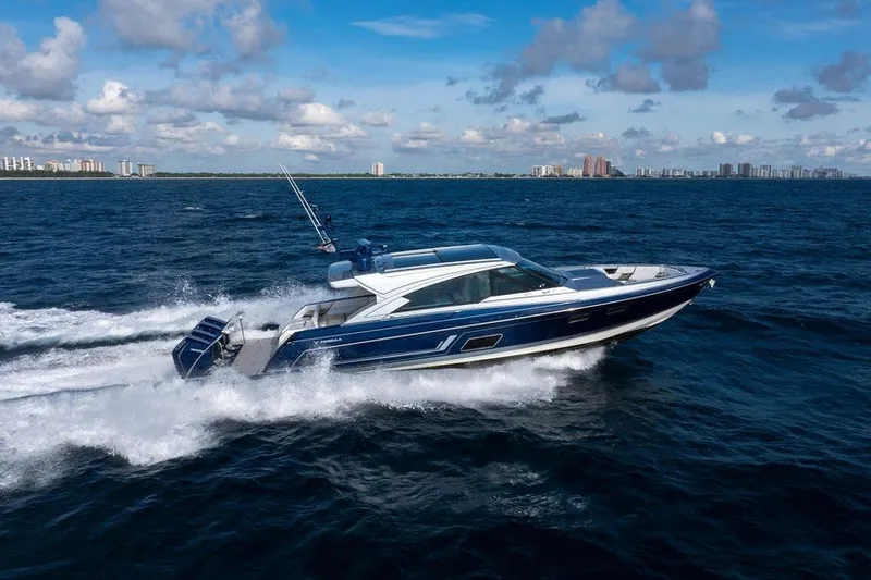 Slide: The Image of 2025 Formula 500 Super Sport Crossover cruising on open water under a clear blue sky. - 15