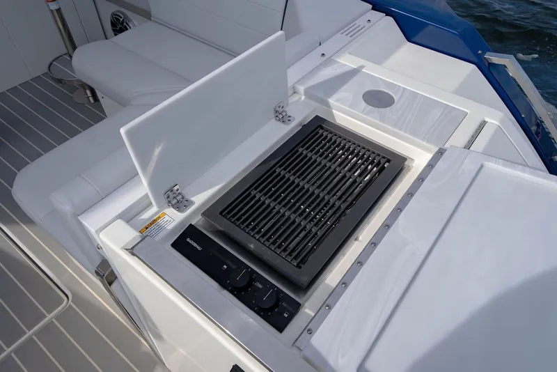 Slide: The Image of Outdoor grill on 2025 Formula 500 Super Sport Crossover boat deck, featuring sleek design. - 61